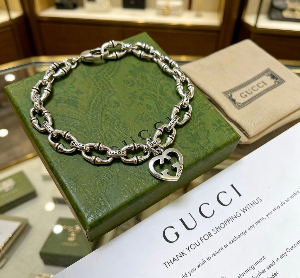 Gucci Silver-Tone Openwork Oval Link Bracelet with G Charm - album image 4