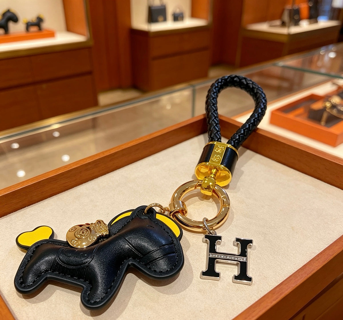 Hermès Black Horse Keychain with Black Braided Cord - album image 1