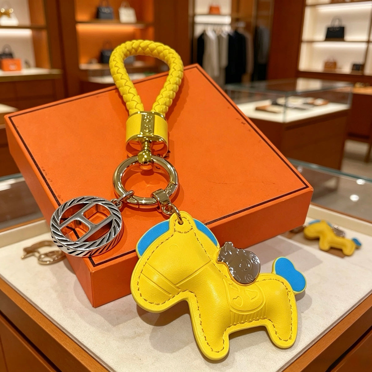Hermès Yellow Horse Keychain with Yellow Braided Cord - album image 1