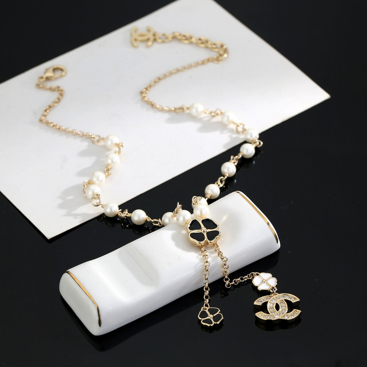 Chanel Interlocking C Pearl Letter Necklace - album image 5