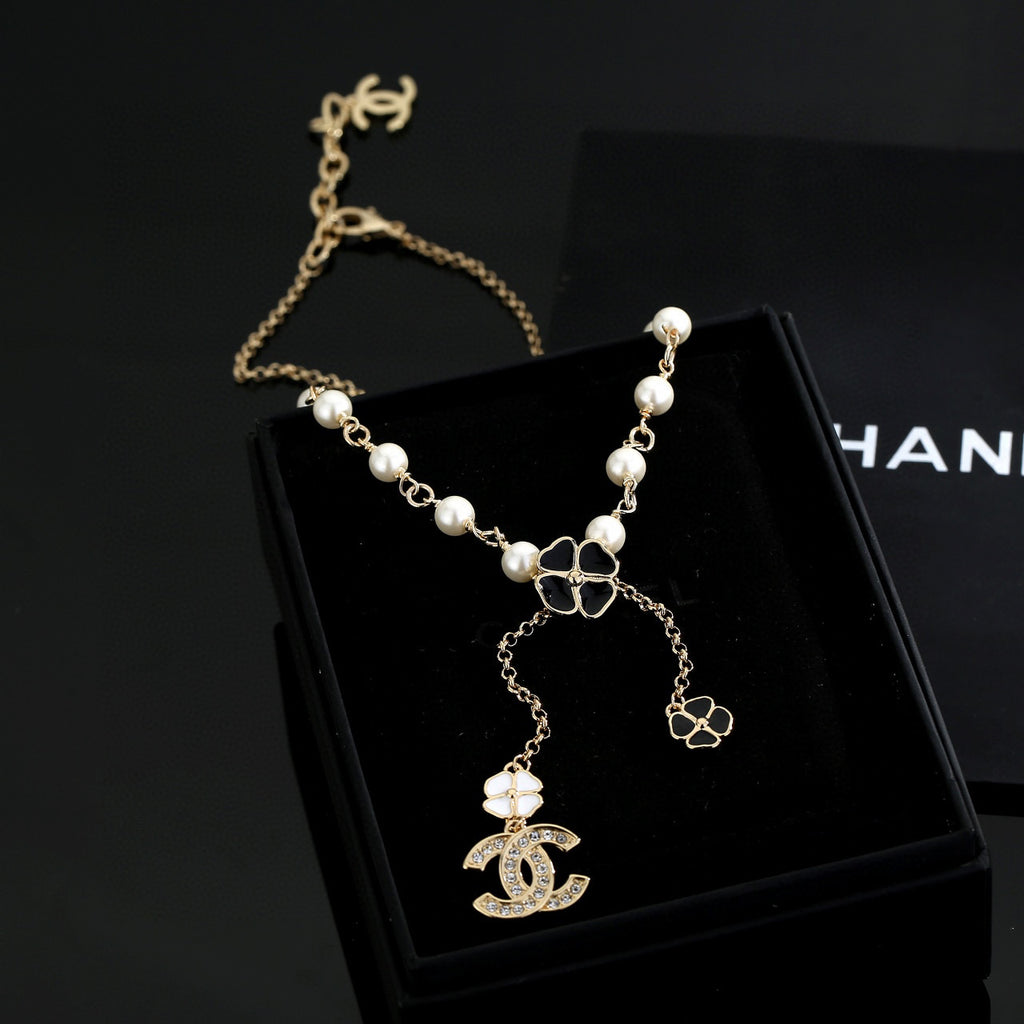 Chanel Interlocking C Pearl Letter Necklace - album image 1