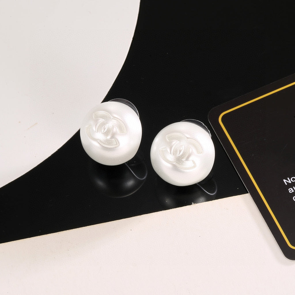 Chanel Interlocking C Resin White Circular Earrings - album image 1