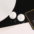 Chanel Interlocking C Resin White Circular Earrings - album image 1