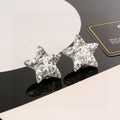 Chanel Interlocking C Resin Silver-Tone White Star Stud Earrings - album image 1