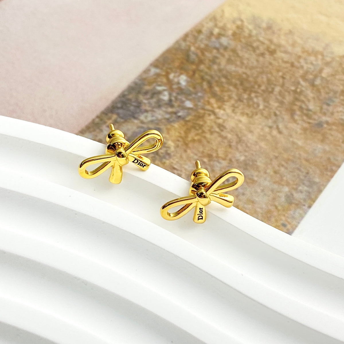 Dior Slim Bow Stud Earrings - product image 1
