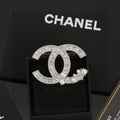 Chanel Interlocking C Pearl Brooch - album image 1
