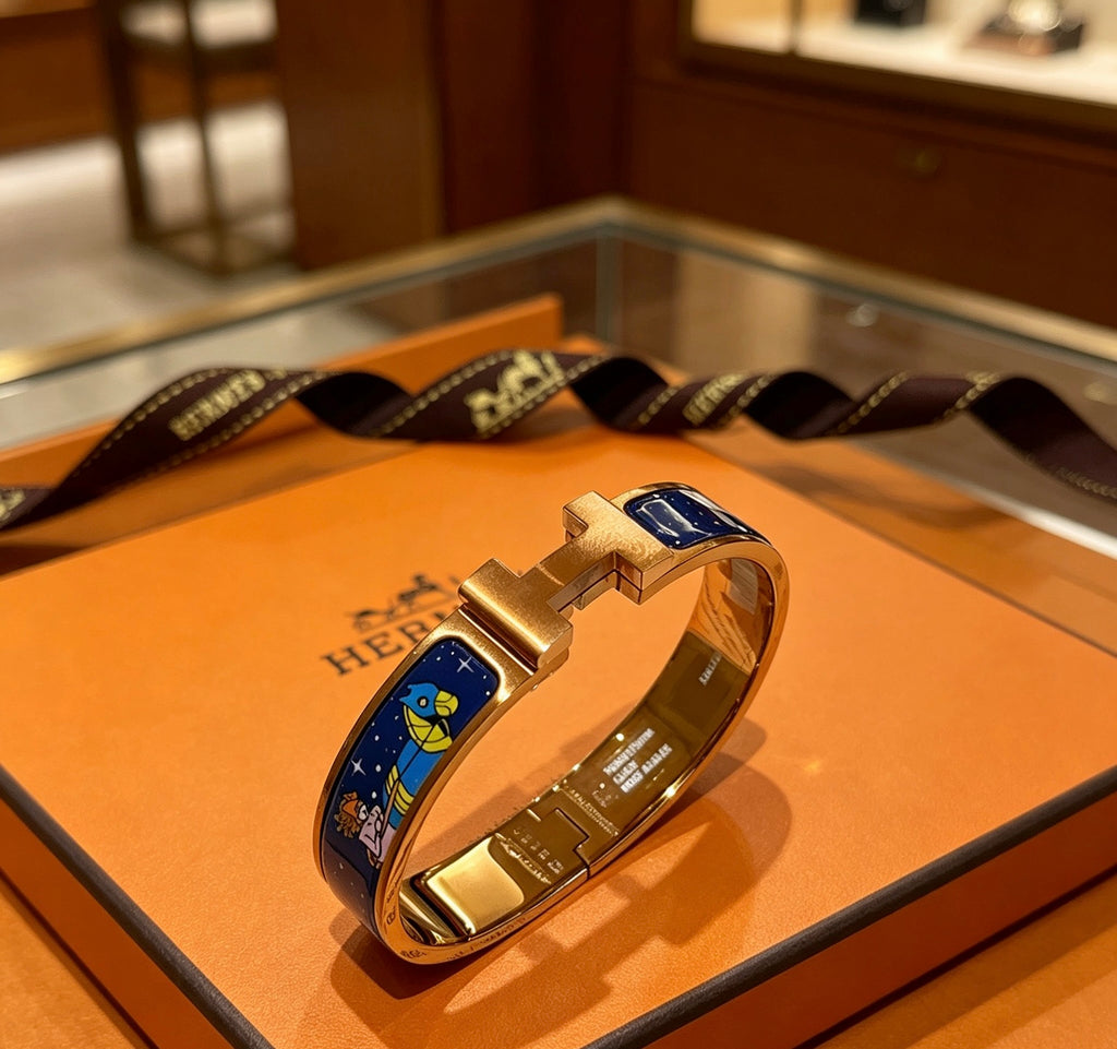 Hermès Gold-Tone Blue Printed H-Clasp Bangle - album image 1