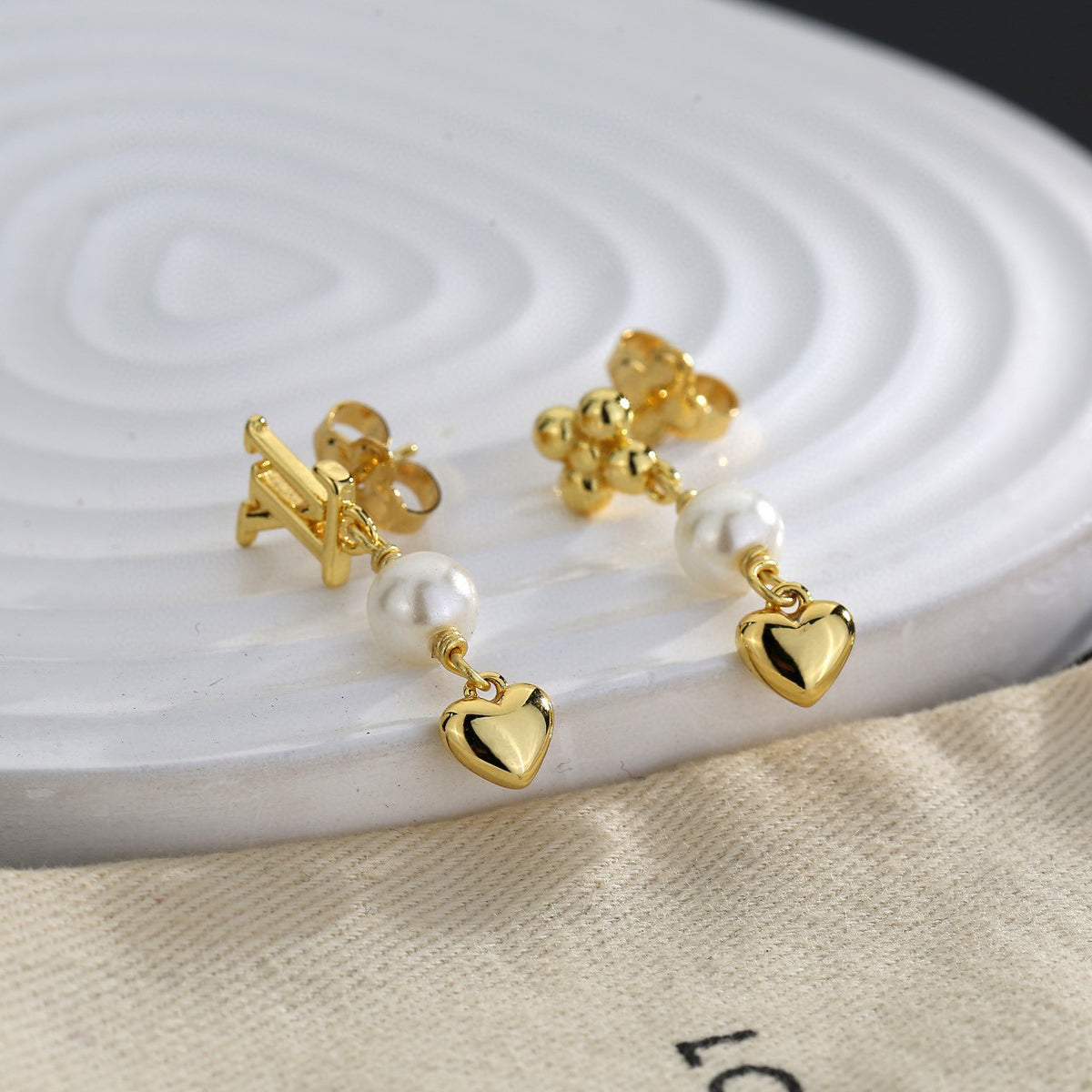 Louis Vuitton LV Letter Stud Earrings - album image 1