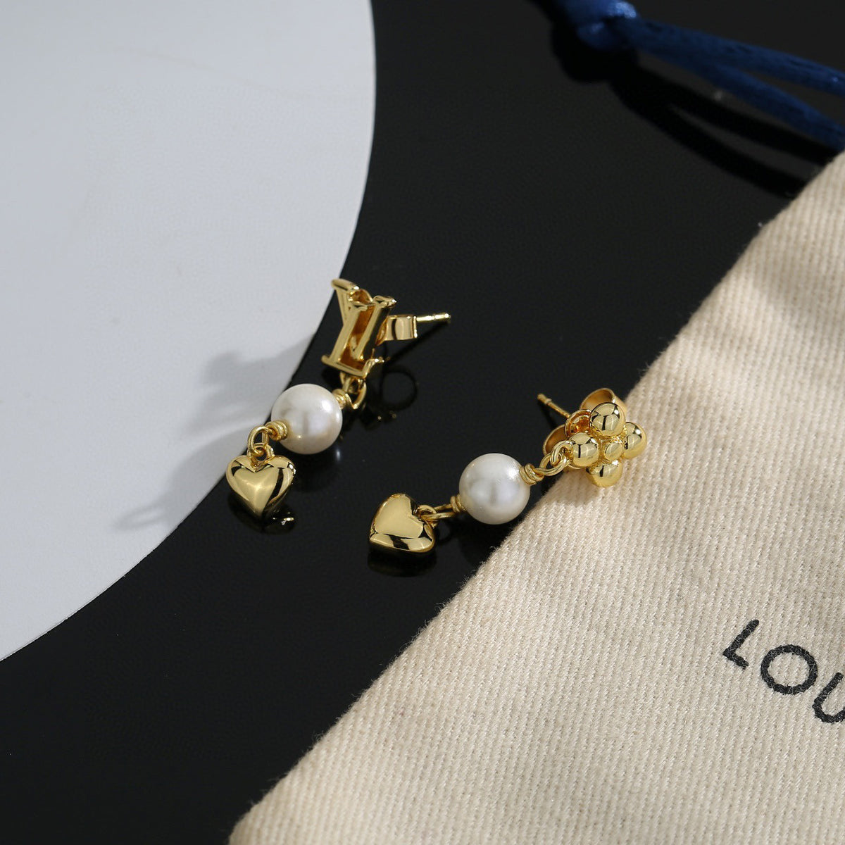 Louis Vuitton LV Letter Stud Earrings - album image 5