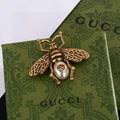 Gucci Gold-Tone Bee and Pearl Brooch - album image 1
