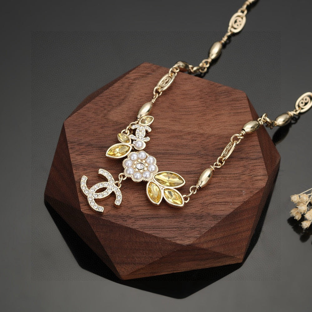 Chanel Camellia Gold-Tone Letter Necklace - album image 6