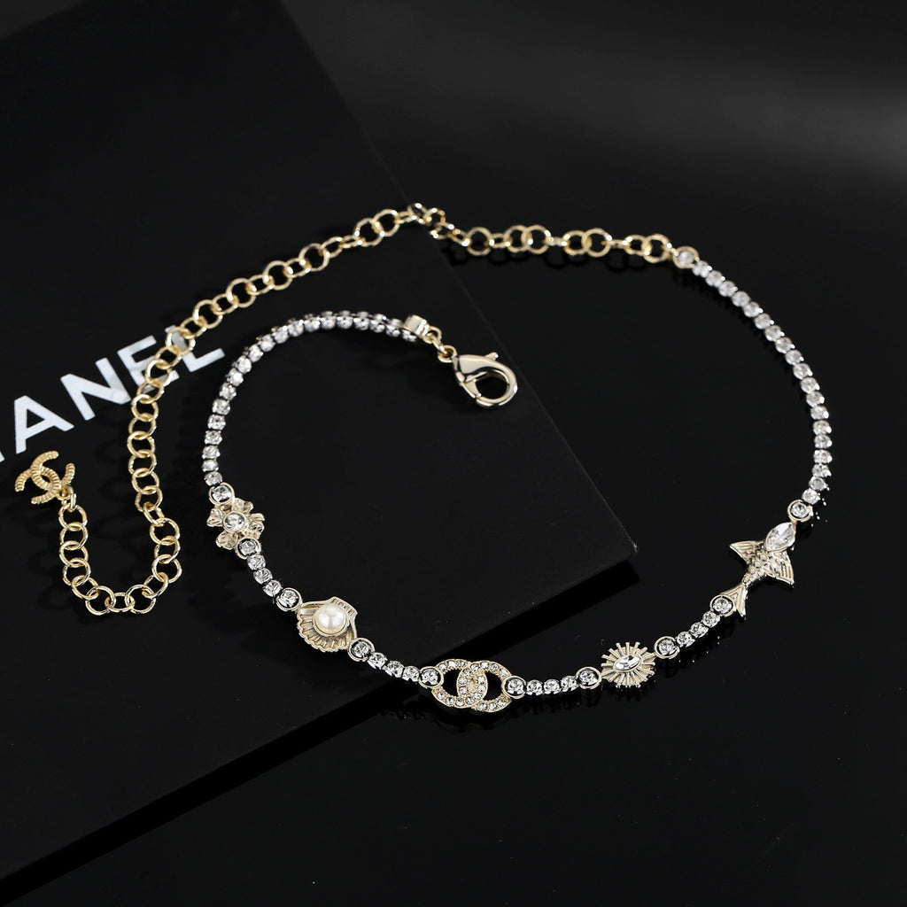 Chanel Interlocking C Shell Gold-Tone Pearl Pendant Necklace - album image 2