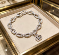 Gucci Silver-Tone Oval Link Bracelet with G Charm - album image 1