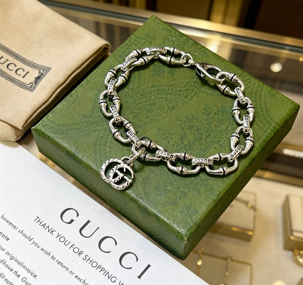 Gucci Silver-Tone Oval Link Bracelet with G Charm - album image 5