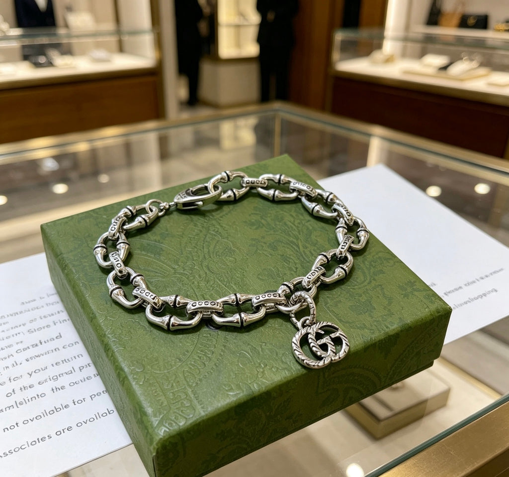 Gucci Silver-Tone Oval Link Bracelet with G Charm - album image 7