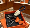 Hermès Orange Horse and H-Charm Keychain with Navy Strap - album image 1
