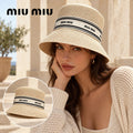 Miu Miu Miu Miu Woven Open Knit Bucket Hat worn by a Western model with product detail inset