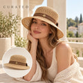 Independent Open Knit Straw Hat worn by a Western model with product detail inset