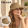 Prada Prada Visor worn by a Western model with product detail inset