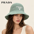 Model wearing prada woven open knit bucket hat on head