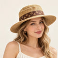 Model wearing woven hat on head